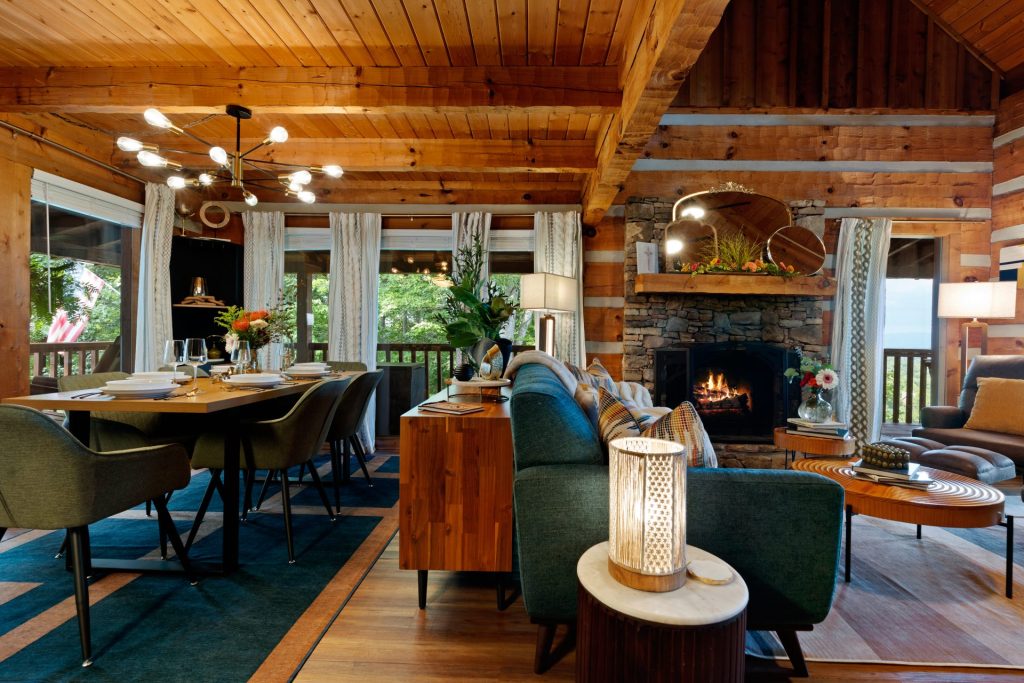 Living and dining area with fireplace at Dancing Embers cabin