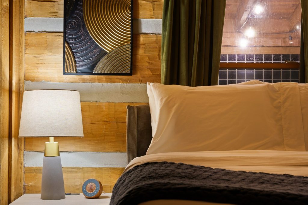 Bedroom with gold accent details at Dancing Embers cabin