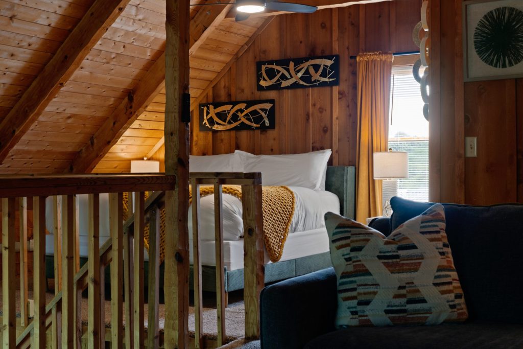 Loft staircase and bed view at Dancing Embers cabin